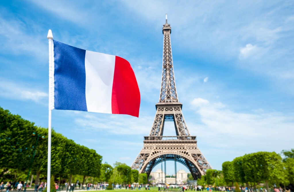 French flag above the Eiffel Tower, Paris